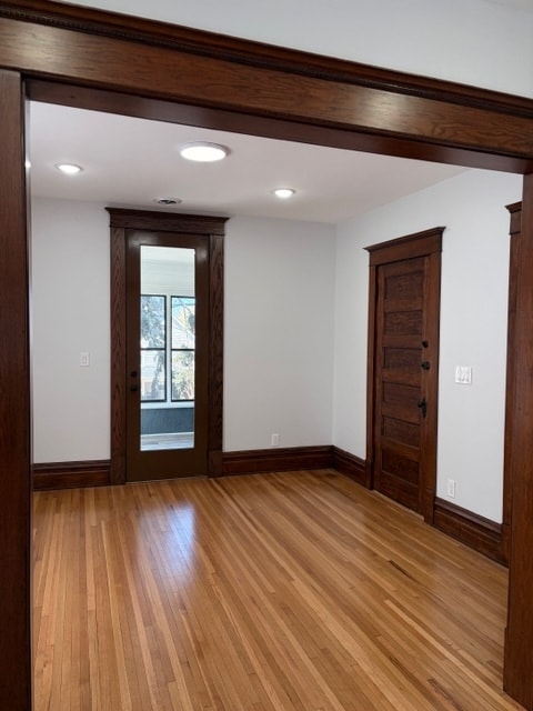 Living room with the door leading to the three-season porch. - 623 Pierce St NE