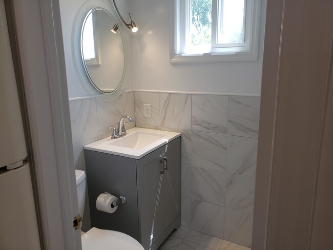 Updated half bath on main level - 375 Hope St