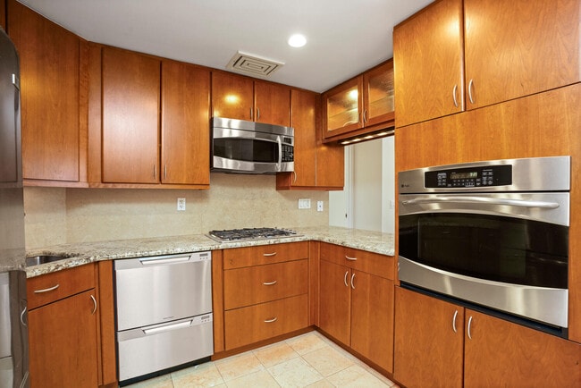 Enjoy beautiful marble counter and cherry cabinets. - 50 E Hartsdale Ave