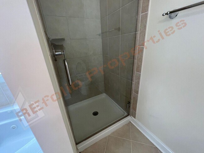Building Photo - Elegant 3 Story 3 Bedroom Formal Model Tow...