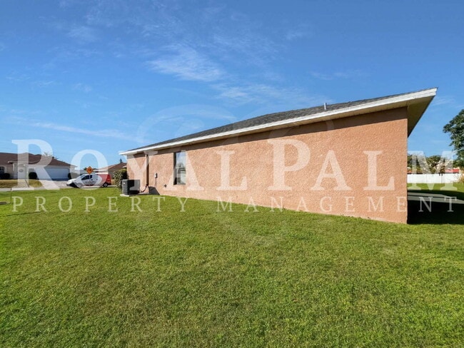 Building Photo - 3 Bed 2 Bath in Cape Coral — Curb Appeal. Fresh Style. Zero Hassle.