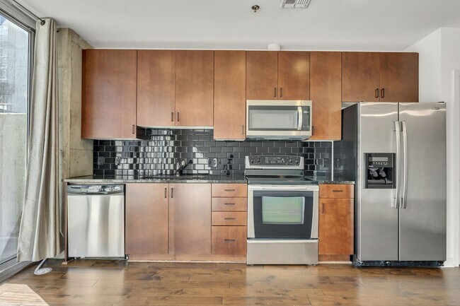 Building Photo - Stunning condo in the heart of SoBro at the Encore! Beautiful 1 bed, 1 bath on the amenity floor ...