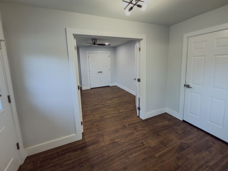 Bedroom entry from hallway with hardwood floors - 2006 Candle Ct