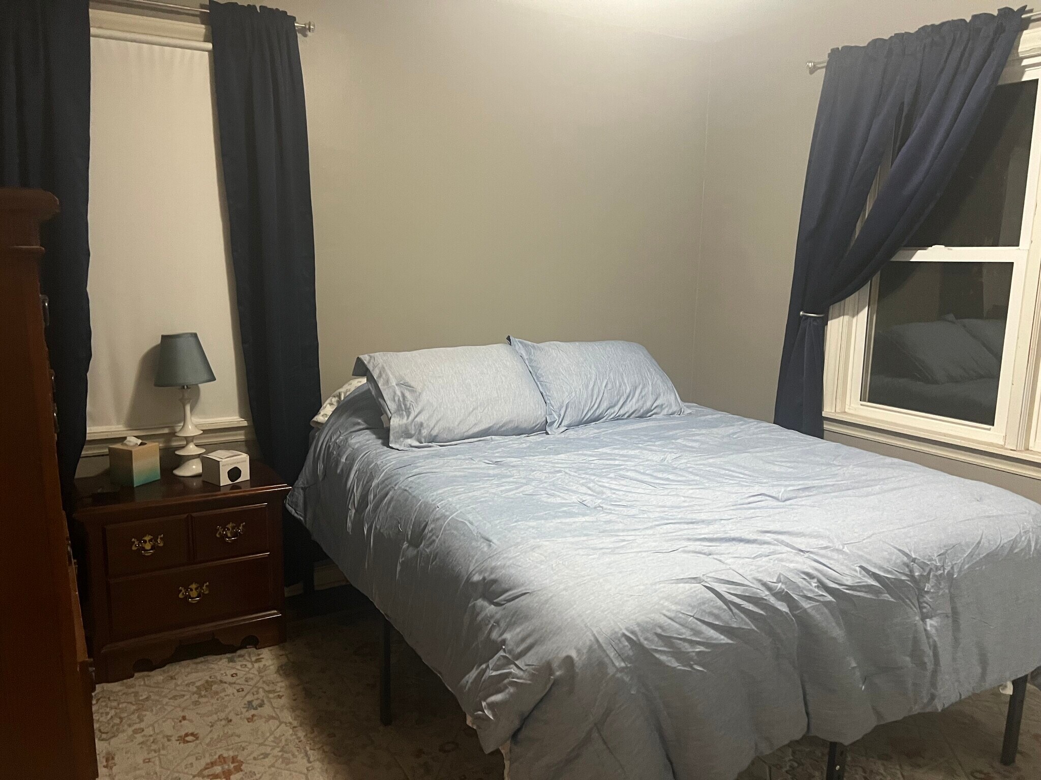 Comfortable memory foam bed with new bedding and pillows. - 4622 Cass St