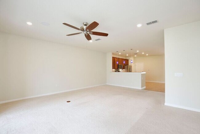 Building Photo - Immaculate Townhome · Dual En-Suite Bedrooms + Flex Loft · Cable & Internet Included · 3.5 Miles ...