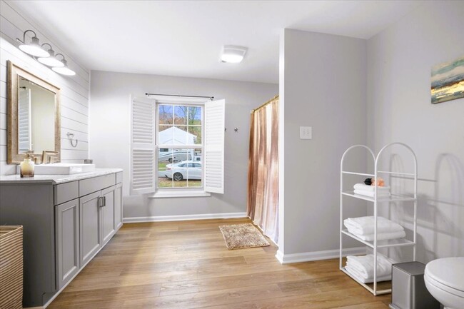 Spacious full bathroom in the master suite, with handrails. - 34 Shenandoah Dr