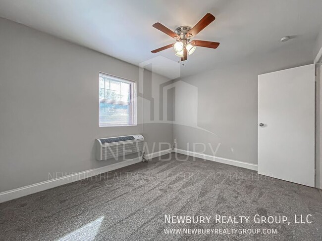 Building Photo - Modern One-Bedroom Apartment in Port Vue: ...