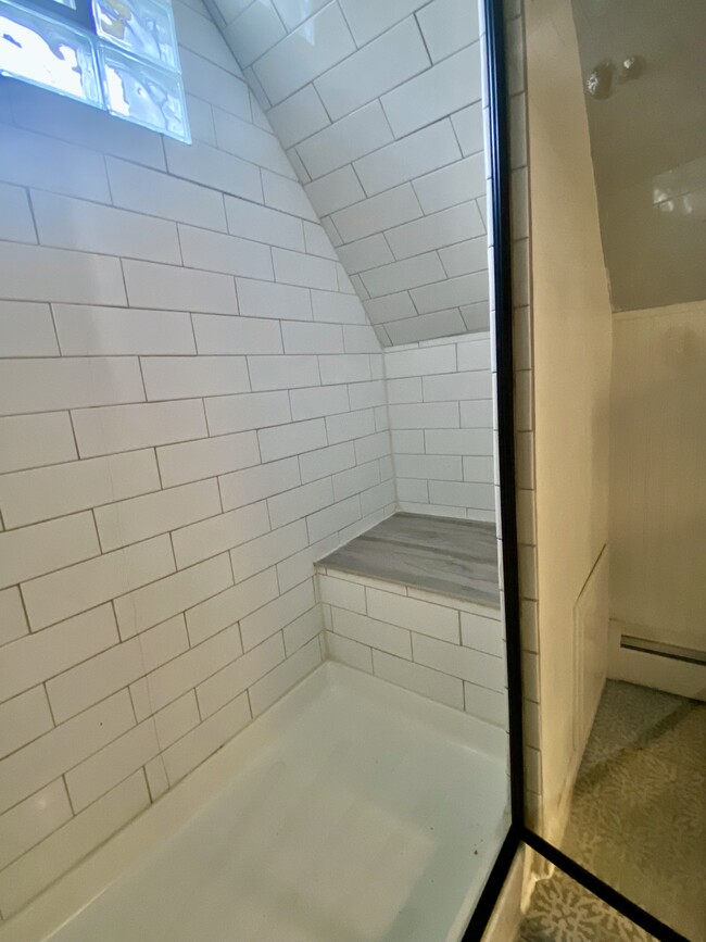 Walk in shower with built-in granite seat. - 16 Eames St