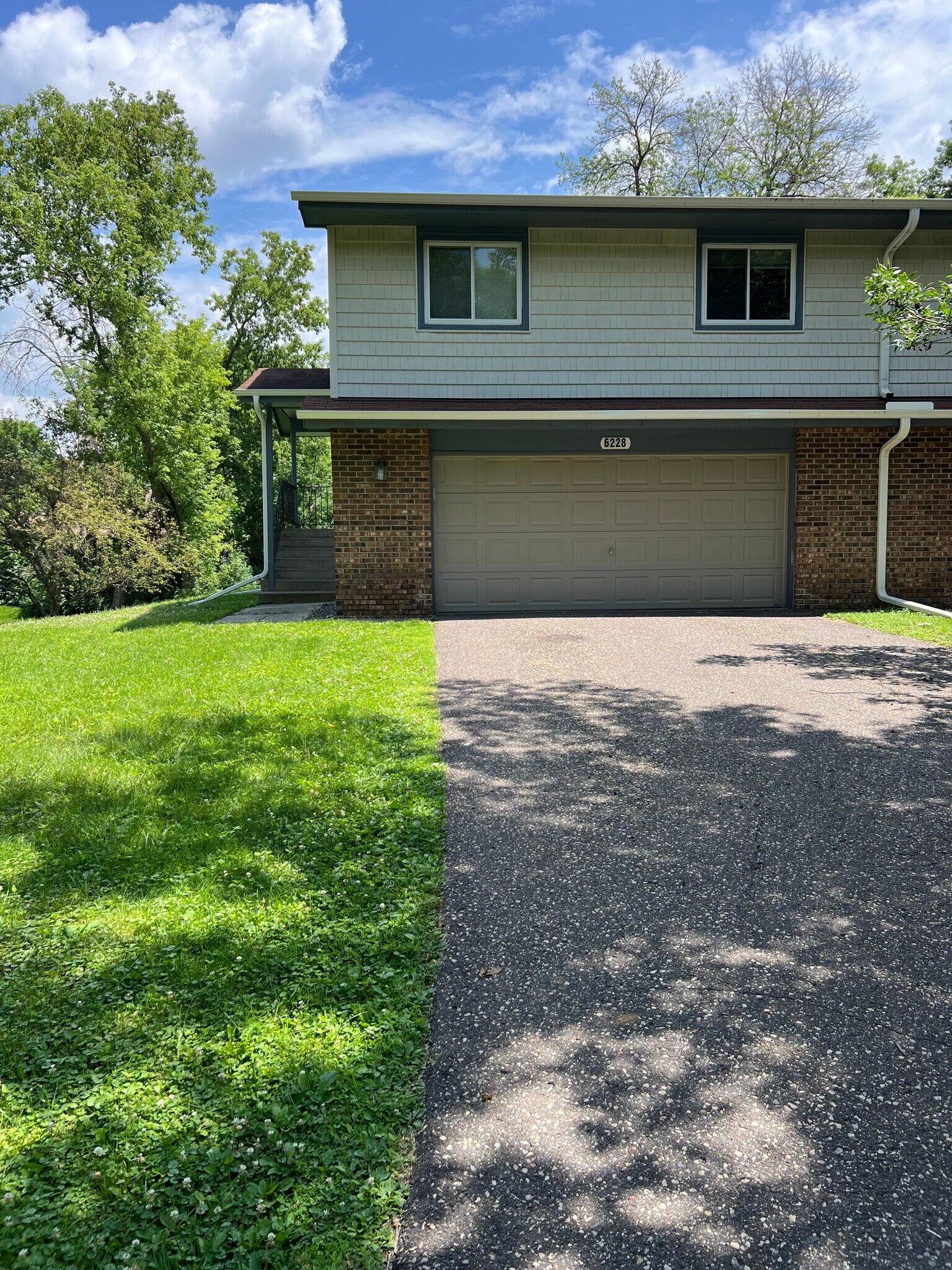 front yard, 2 car garage with entrance to basement. - 6228 Magnolia Ln N