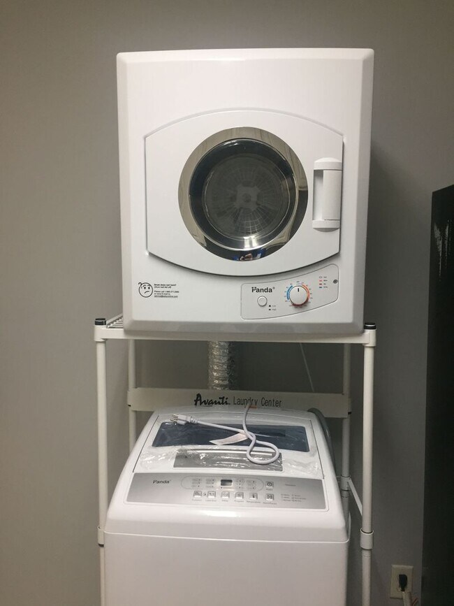 Building Photo - Beautiful 2/1B all tiled 2nd floor condo i...