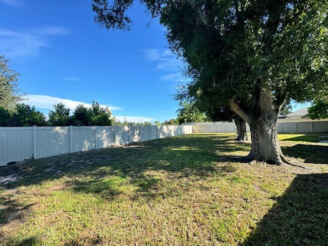 Building Photo - 2/2 with Fenced Yard, Garage and Laundry, ...
