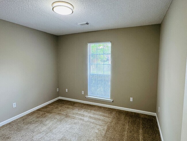 Building Photo - Your new home is just a putt away with thi...
