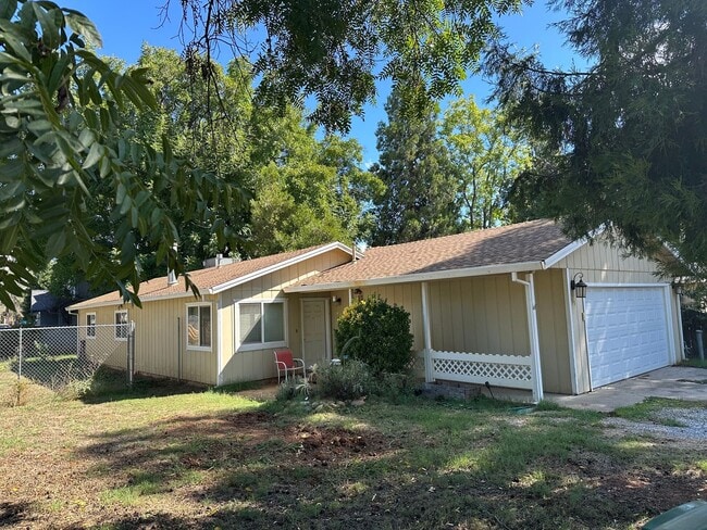 Building Photo - Charming Redding Home with Fireplace & Vau...