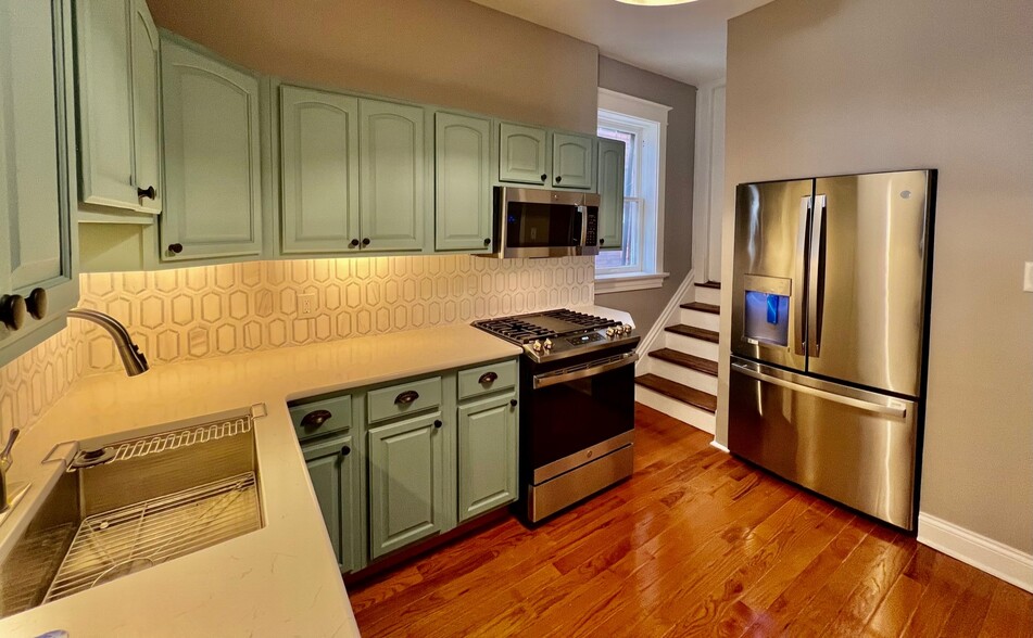 Kitchen with Granite Countertops and Stainless Appliances - 5818 De Giverville Ave