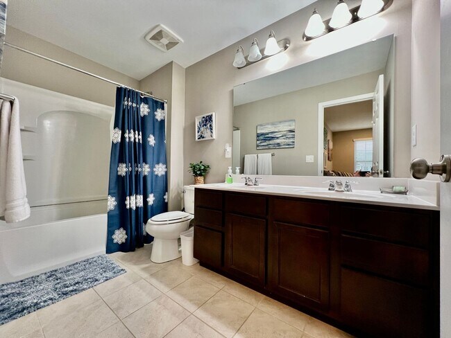 Building Photo - Executive corporate rental features community pool. Fully furnished and includes all utilities.