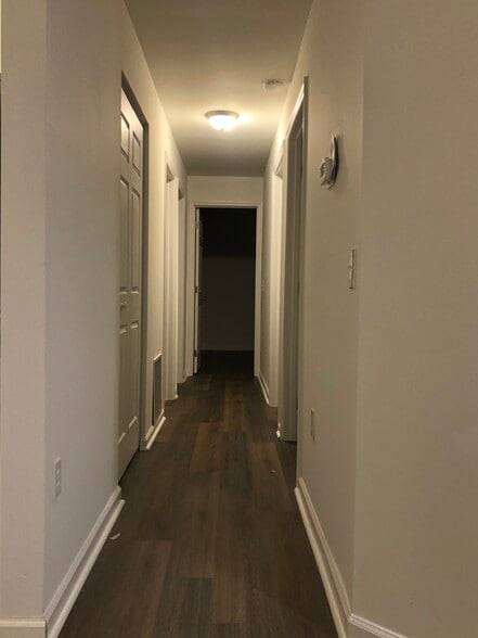 Freshly painted hallway with new flooring - 261 Simpson Ave