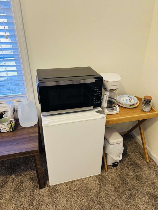 Mini fridge, coffee maker, microwave, trash can, starter supplies. - 105 Lincoln Place Cir