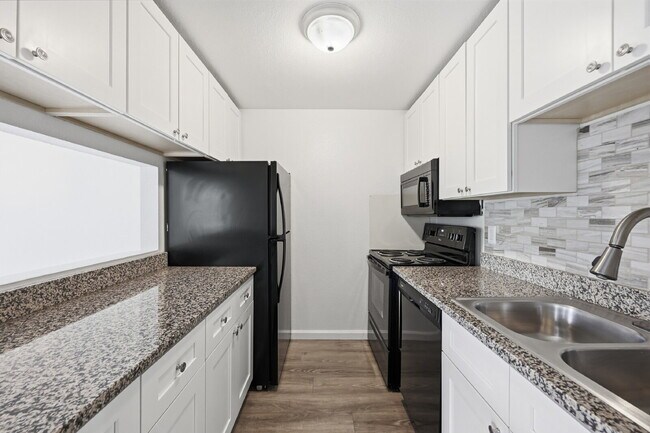 Building Photo - $1,440.95 with $300 Off the first month's rent,  2 Beds - 1 Bath, Condo in Denver with Granite Co...