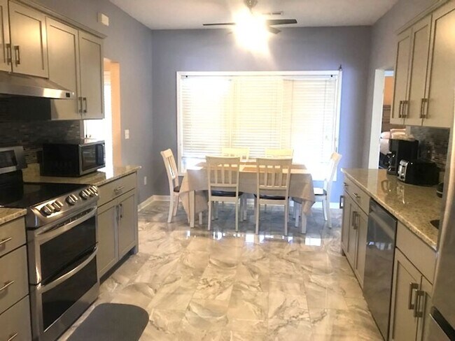 Building Photo - 4 Bedroom, 2.5 Bath, Pet Friendly Home with Fenced Yard & Sunroom! Available Soon!