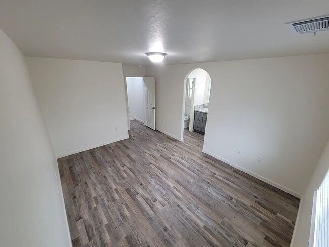 Building Photo - Freshly painted home, LVP flooring, close to schools, park, and shopping. Quiet neighborhood near...