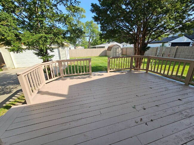 Building Photo - Clean 3-Bedroom Tri-Level, 1.5 Bath with Updated Kitchen, Great Room, Fireplace & Private Backyar...