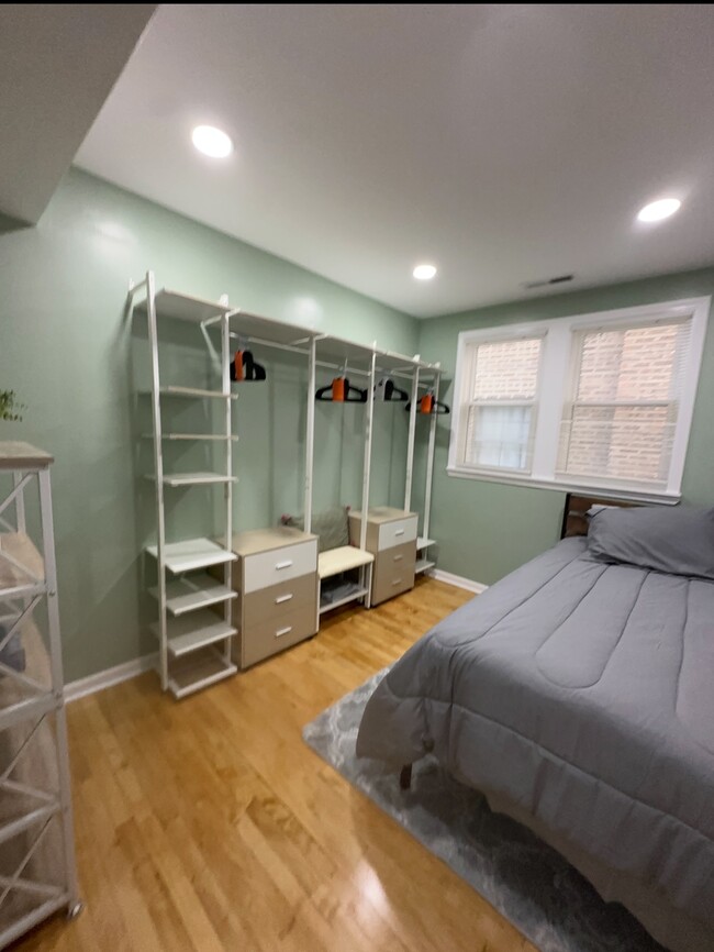 Walk-in closet with an extra bed - 3227 N Keating Ave