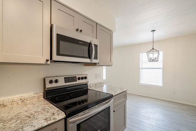 Building Photo - Updated home with large backyard & 2 car g...