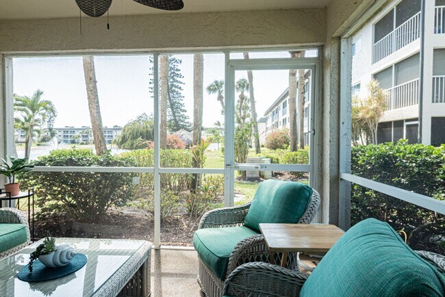 Building Photo - AVAILABLE NOW! Furnished Ground-Floor End Unit | Lake & Pool Views | Minutes to Marco Island & Do...