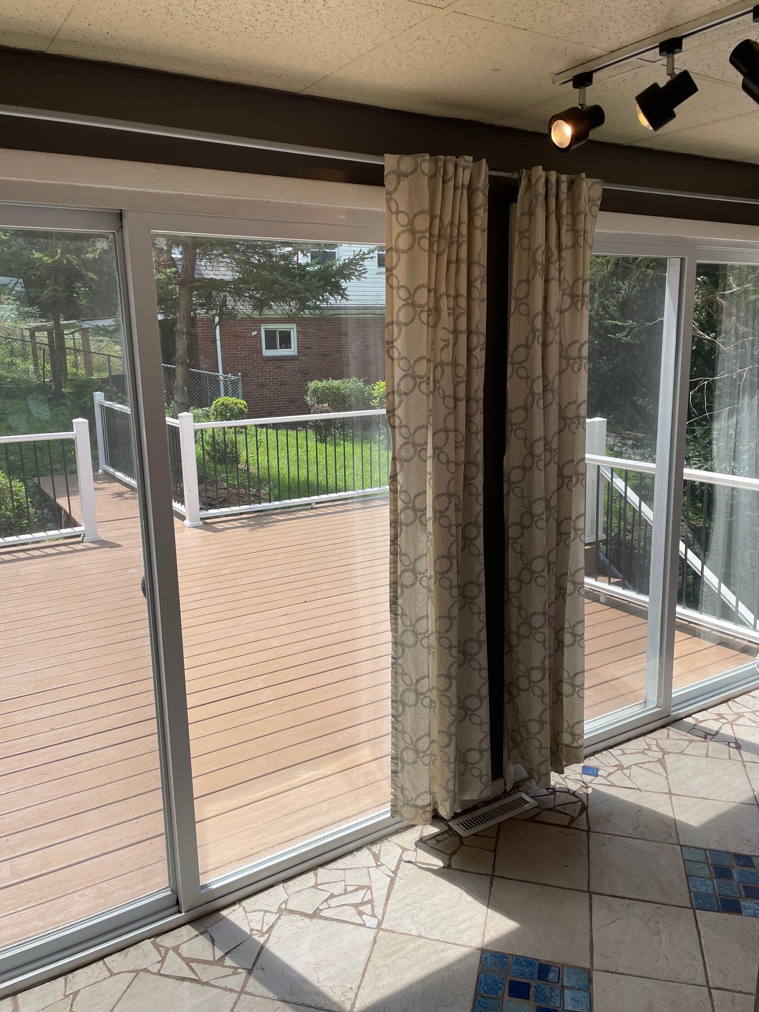 Dual sliding glass doors to the deck with screen doors - 227 Wilbert St