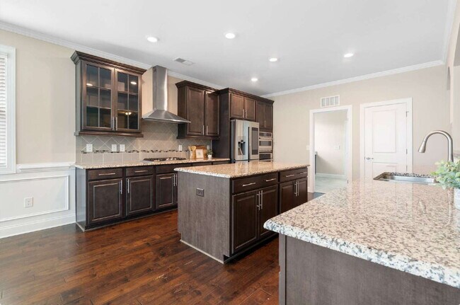Building Photo - Luxurious 4-Bedroom Retreat with Third Floor Bonus Room & Fenced-in Backyard