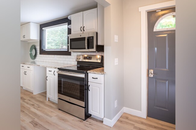 Kitchen w/ new stainless appliances. - 222 6th Ave SE