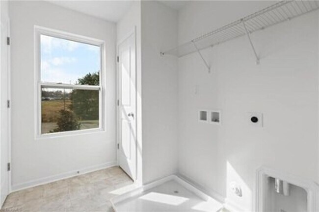 Building Photo - Spacious 3-Bedroom Townhome with Private Patio, Central HVAC & In-Unit Laundry Hookups
