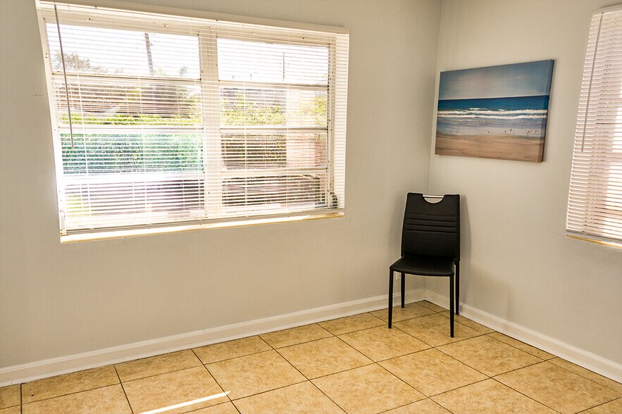 Master bedroom with tile floor, view of huge backyard - 126 S E St