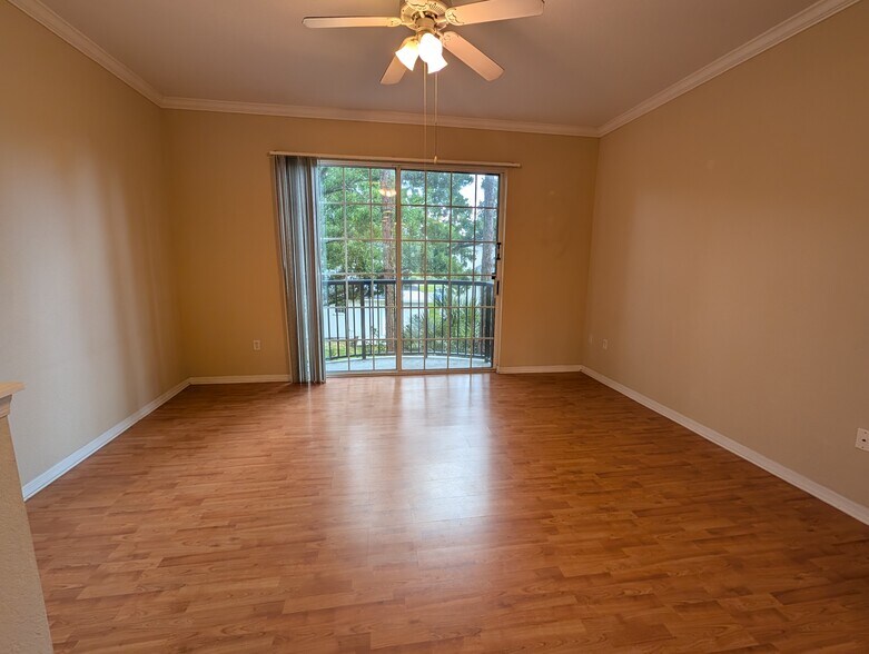 Living room with balcony access - 5218 Hampton Beach Pl