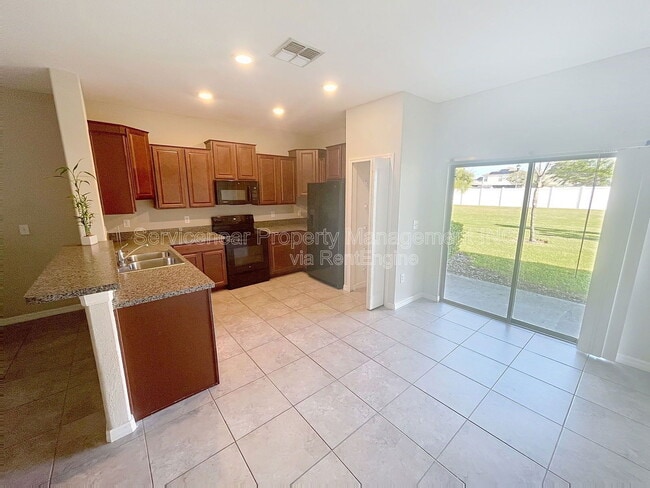 Building Photo - 7648 Ginger Lily Ct