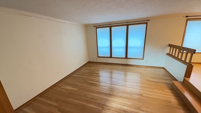 Building Photo - 4bd/3ba HUGE Home w/Hardwood Floors, Russian Fireplace, 2-Car Garage & Fenced Back Yard!