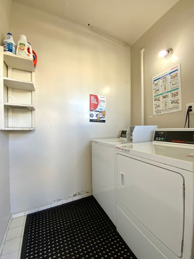 Building Photo - RENOVATED and Private. DISHWASHER, ON-SITE LAUNDRY, HARDWOOD!