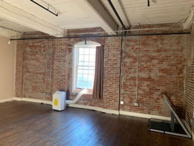 Building Photo - Downtown Studio at Riverviews — Exposed Brick & City Views
