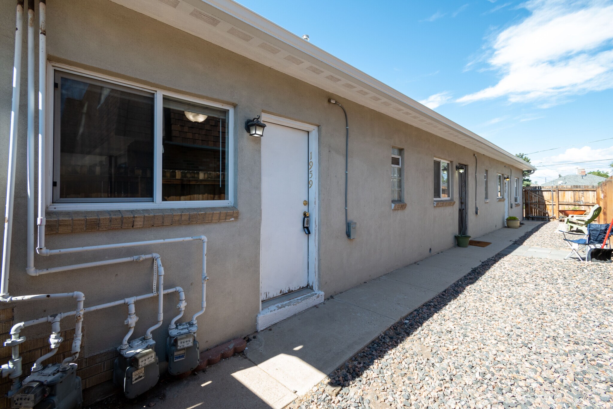 Front Door and shared gravel courtyard - 1959 Oswego St