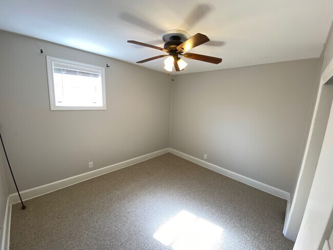 Second bedroom with south facing window and large closet - 225 N Franklin St