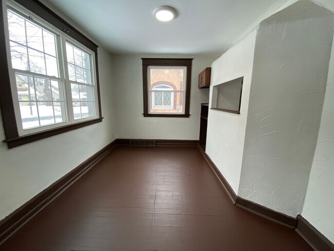 Building Photo - Cozy Akron Home w/ Fireplace Charm, Detached Garage & Back Porch