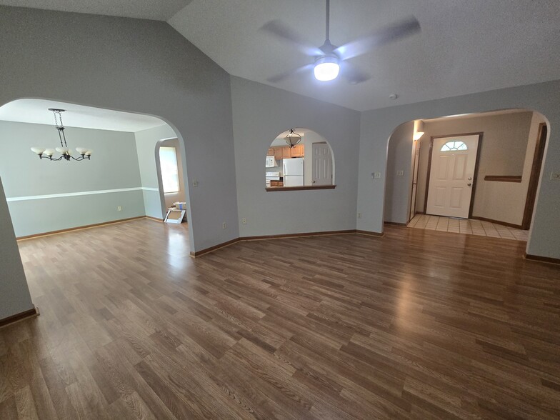 Living room to dining room and entry view - 3700 Falmouth Dr