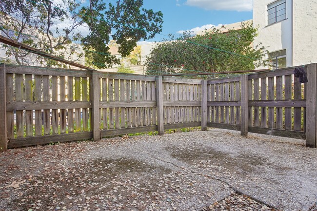 Wooden fence with a yard in front of a house - 2363 Le Conte Avenue