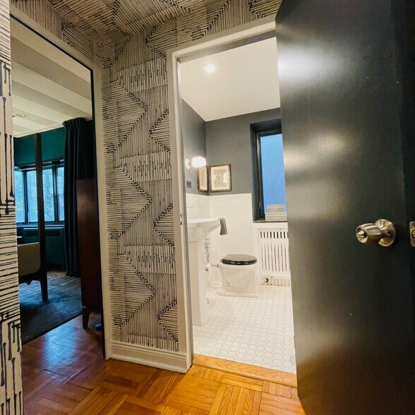 Small hallway opens to bathroom - 5048 N Marine Dr