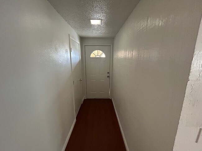 Building Photo - Single story home with large backyard and huge carport with plenty of storage.