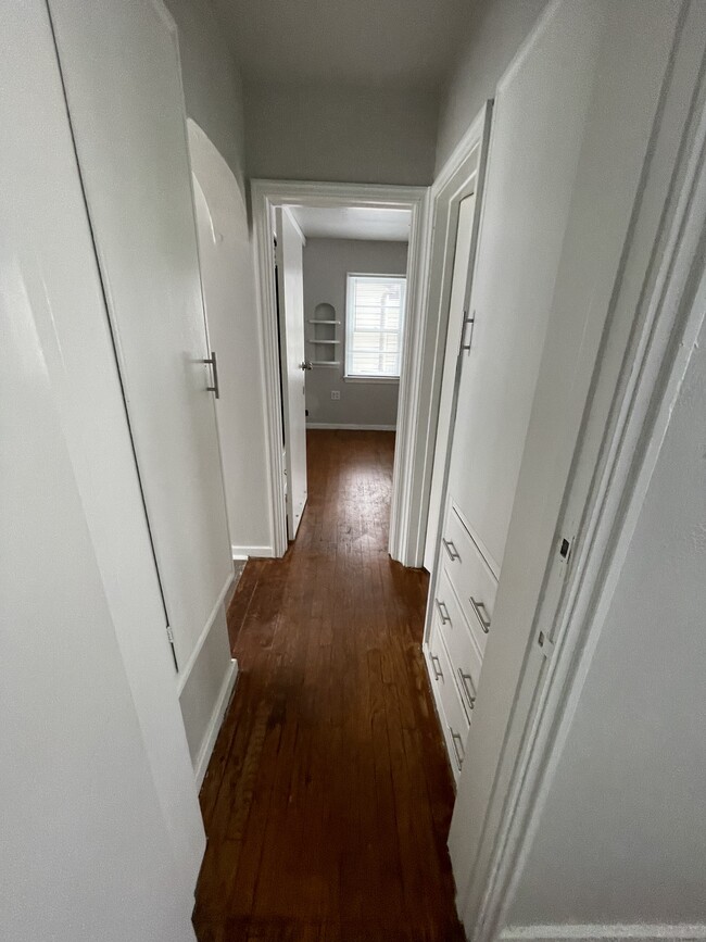 Hallway between bedrooms with large linen closet outside of bathroom - 1831 Smith St