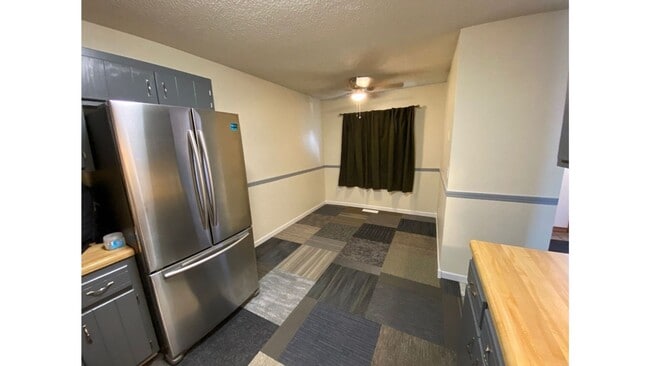 Building Photo - Spacious 3 - Bedroom Townhome with Modern Updates & Private Green Space.