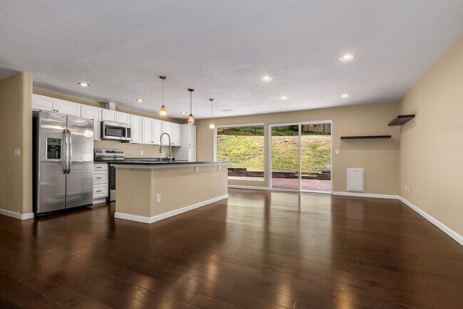 Building Photo - Updated Charmer with Open Kitchen, Private Yard & 2-Car Garage