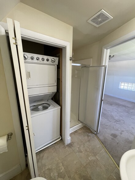Bath with stackable washer dryer - 225 E 6th Ave