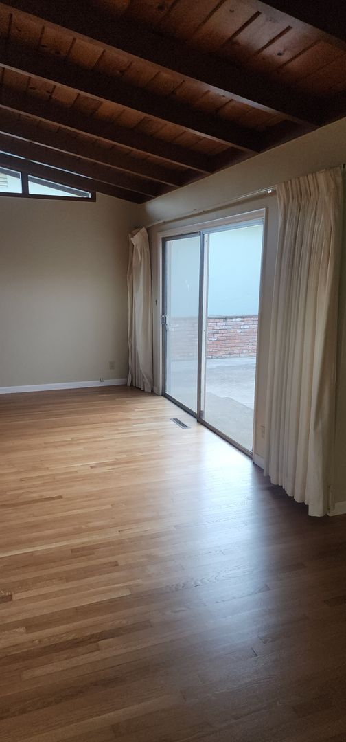 Building Photo - This is a spacious house featuring four bedrooms and two bathrooms, along with a two-car garage.